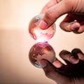 Male hand holding world globe crystal glass Royalty Free Stock Photo