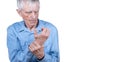 Male hand holding wrist. Eldery man suffering from pain in hand. Bone disease, arthritis or arthrosis.  Isolated on white Royalty Free Stock Photo