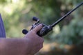 The male hand holds the baitcasting reel Royalty Free Stock Photo