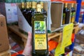 a male hand holds a bottle of olive oil in a large supermarket. Royalty Free Stock Photo