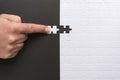 Male hand holds the last piece of the puzzle Royalty Free Stock Photo