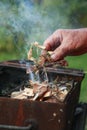 A male hand holds making fire Royalty Free Stock Photo