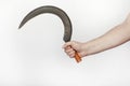 Male hand holds a old sickle Royalty Free Stock Photo