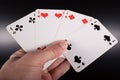 A hand with playing cards