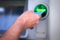 Male hand inserting credit card into a bank machine to withdraw money Royalty Free Stock Photo