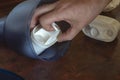 A male hand installs a new tap water purification cartridge into a jug