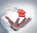 Male hand with keys and a house shaped key chain Royalty Free Stock Photo