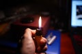 Male hand lighting a cigarette lighter Royalty Free Stock Photo