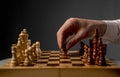 Male hand moving pawn on chess board, starting game. Making business decision concept Royalty Free Stock Photo