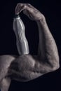 Male hand of muscular man with biceps, triceps, drink bottle Royalty Free Stock Photo