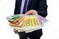 Male hand offering euro banknotes close up Royalty Free Stock Photo