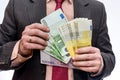 Male hand offering euro banknotes close up Royalty Free Stock Photo