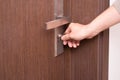 Male hand open a closet door by a key Royalty Free Stock Photo