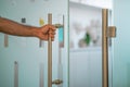 Man hand open the office glass door Royalty Free Stock Photo