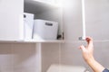 Male hand opening cabinet in the kitchen Royalty Free Stock Photo