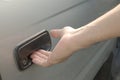 Male hand opening car door from outside Royalty Free Stock Photo