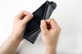 Male hand opening an empty wallet on white background. World economic crisis. Financial problem jobless, bankruptcy concept. Copy Royalty Free Stock Photo