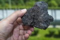 Male hand with a piece of coal Royalty Free Stock Photo