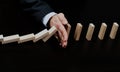 Male hand placing wooden block on a tower. planing and strategy concept. Royalty Free Stock Photo