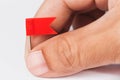Male hand with plastic red flags pin Royalty Free Stock Photo