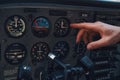 Male hand pointing at aircraft instrument panel Royalty Free Stock Photo