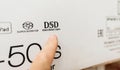 Male hand pointing to the DSD Direct Stream Digital logotype