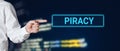 Male hand points to the word piracy. Internet technology cyberspace piracy crime