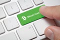 Male hand pressing computer key with Bitcoin cash Royalty Free Stock Photo