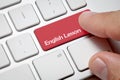 Male hand pressing computer keyboard English lesson button Royalty Free Stock Photo