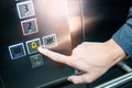 Male hand pressing on emergency button in elevator Royalty Free Stock Photo