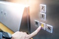 Male hand pressing on emergency button in elevator Royalty Free Stock Photo