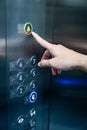 Male hand pressing on emergency button in elevator Royalty Free Stock Photo