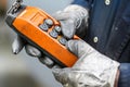 Male hand push remote control switch for overhead crane in the factory, close-up. Electrical control panel of the crane Royalty Free Stock Photo