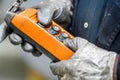 Male hand push remote control switch for overhead crane in the factory, close-up. Electrical control panel of the crane Royalty Free Stock Photo