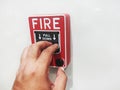 The male hand is pushing the fire alarm Royalty Free Stock Photo