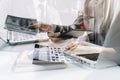 Male hand putting coins with money stack step growing growth and dollar bag. saving money, Concept finance business investment Royalty Free Stock Photo