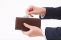 Male hand putting condom into the wallet Royalty Free Stock Photo