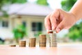 Male hand putting money coins stack Royalty Free Stock Photo