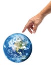Male hand reaching to touch blue planet Earth