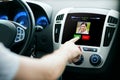 Male hand receiving video call on car panel screen Royalty Free Stock Photo