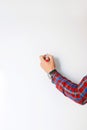 Male hand with a red marker draws a strategy on a white board