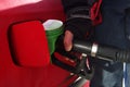 Male hand refilling the car with fuel pistol on a filling Station. Crude oil prices and gas price. The world`s most expensive fuel Royalty Free Stock Photo