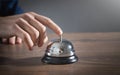 Male hand ringing in service bell Royalty Free Stock Photo