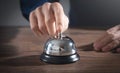 Male hand ringing in service bell Royalty Free Stock Photo