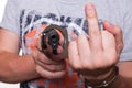 Male hand robber in handcuffs with a gun isolated Royalty Free Stock Photo