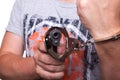 Male hand robber in handcuffs with a gun Royalty Free Stock Photo