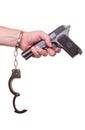 Male hand robber in handcuffs with a gun isolated Royalty Free Stock Photo