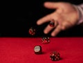 Male hand rolling dice Royalty Free Stock Photo