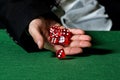 Male hand rolling five dice Royalty Free Stock Photo