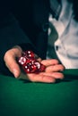 Male hand rolling five dice Royalty Free Stock Photo